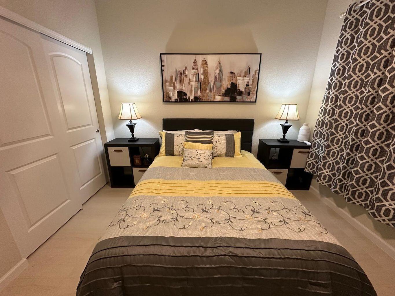 13897 Southwest Gingerline Drive Port St. Lucie, FL 34987 - Photo 39 of 74 a bedroom with a bed and a painting on the wall