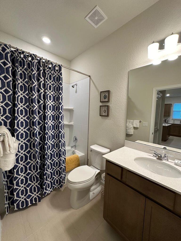 13897 Southwest Gingerline Drive Port St. Lucie, FL 34987 - Photo 42 of 74 a bathroom with a sink toilet and shower