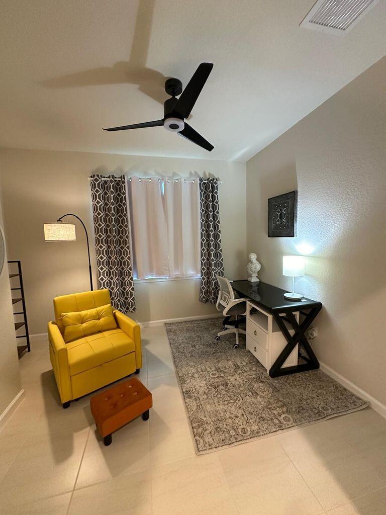 13897 Southwest Gingerline Drive Port St. Lucie, FL 34987 - Photo 50 of 74 a living room with a piano and a table