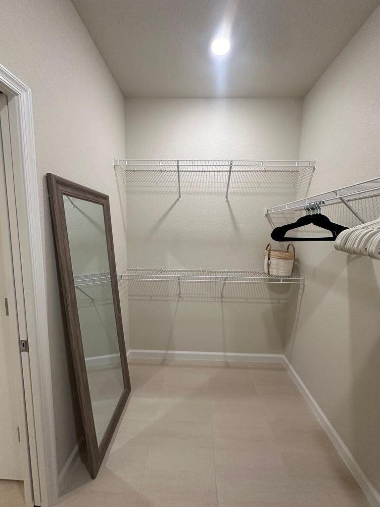 13897 Southwest Gingerline Drive Port St. Lucie, FL 34987 - Photo 55 of 74 a view of a room with racks on the wall