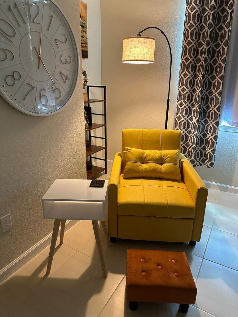 13897 Southwest Gingerline Drive Port St. Lucie, FL 34987 - Photo 56 of 74 a living room with furniture and a mirror