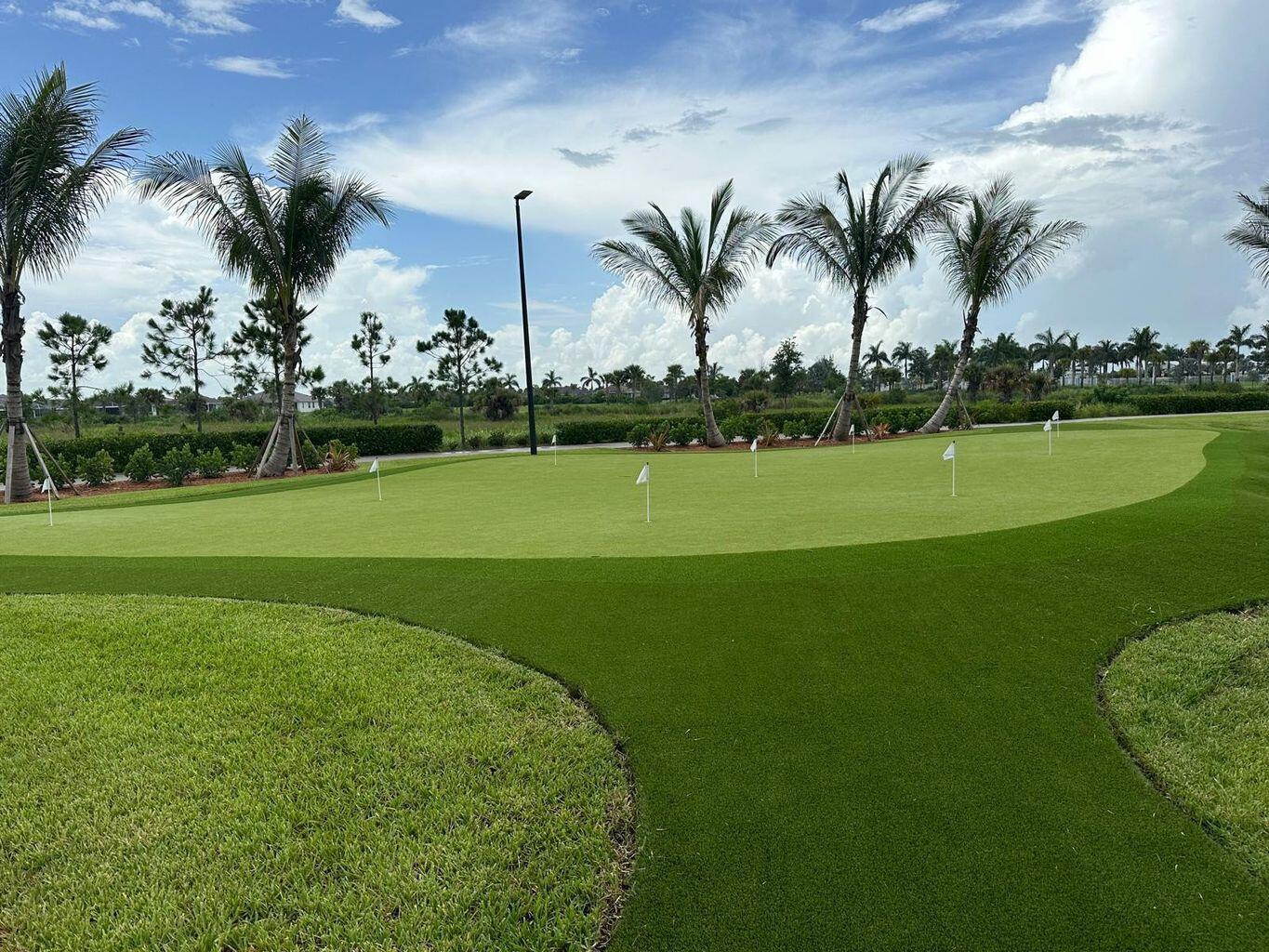 13897 Southwest Gingerline Drive Port St. Lucie, FL 34987 - Photo 68 of 74 a view of a golf course with a lake