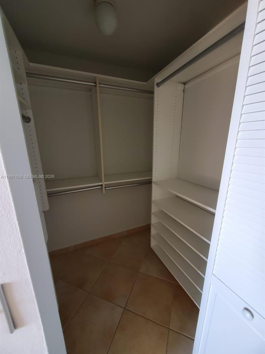 555 Northeast 30th Street, Unit 502 Miami, FL 33137 - Photo 13 of 19 a view of an empty walk in closet