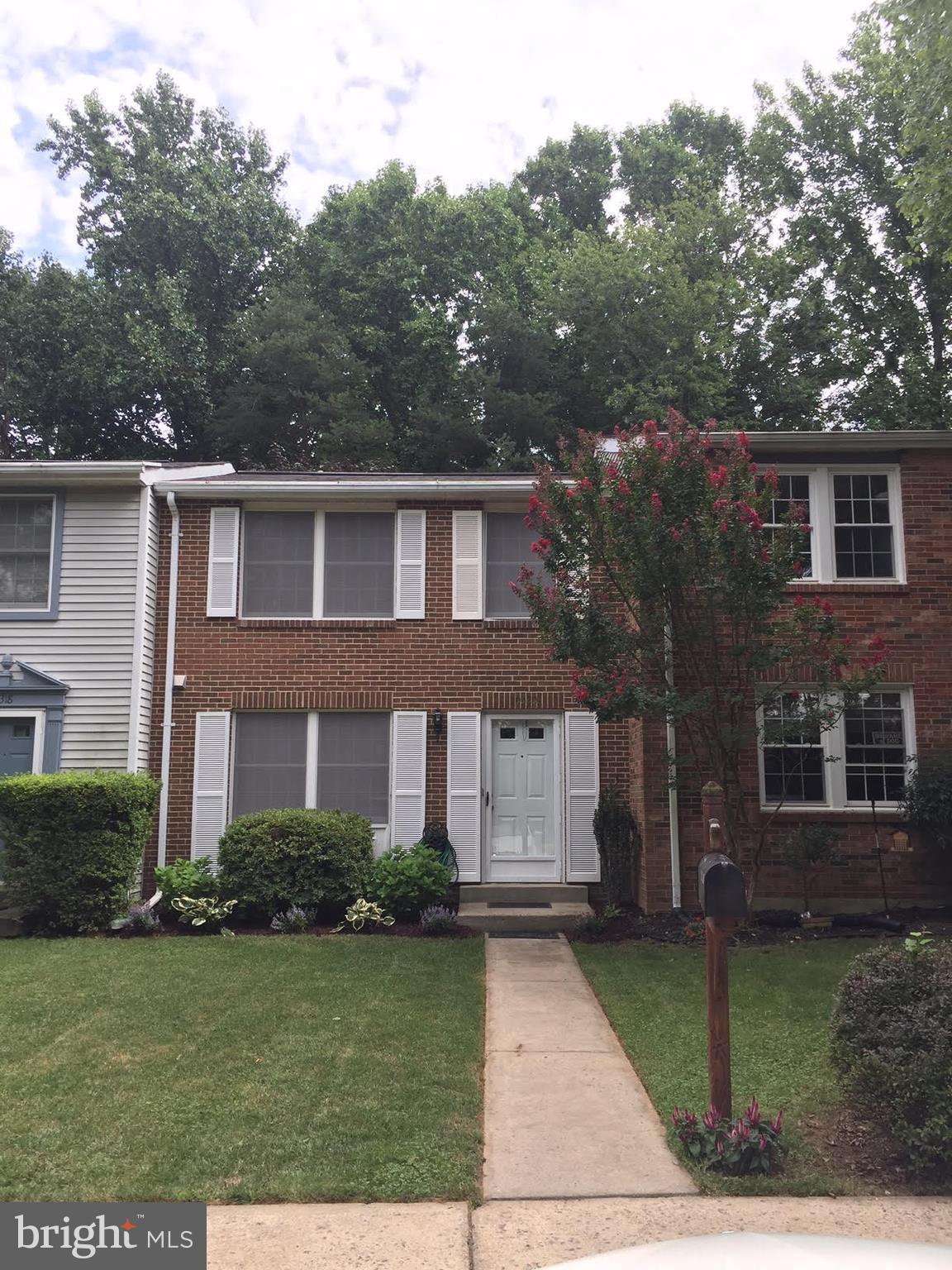10320 Apple Ridge Road Gaithersburg, MD 20886 - Photo 1 of 30 a front view of a house with garden