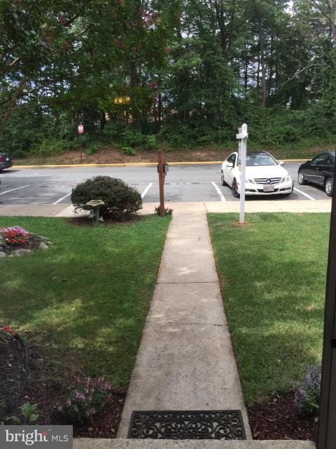 10320 Apple Ridge Road Gaithersburg, MD 20886 - Photo 2 of 30 a view of a garden with lawn chairs