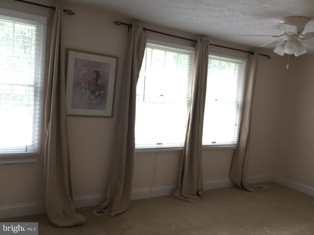 10320 Apple Ridge Road Gaithersburg, MD 20886 - Photo 13 of 30 an empty room with windows