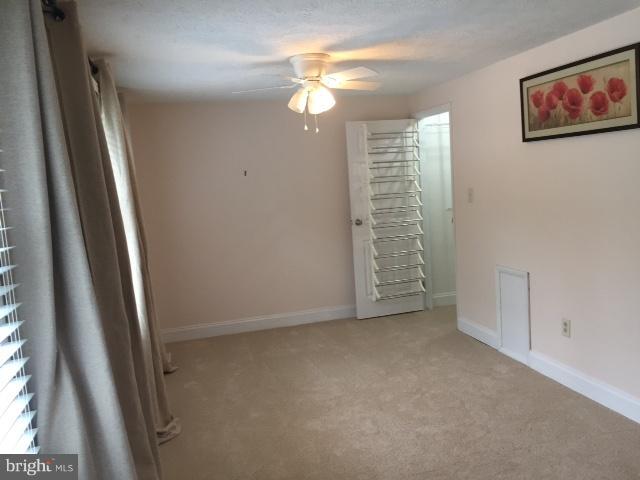 10320 Apple Ridge Road Gaithersburg, MD 20886 - Photo 15 of 30 an empty room with windows and bathroom