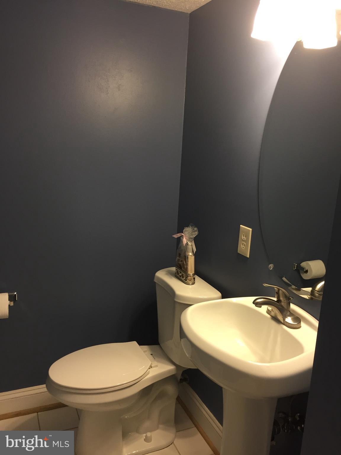 10320 Apple Ridge Road Gaithersburg, MD 20886 - Photo 17 of 30 a bathroom with a sink toilet and a mirror