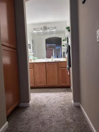 a kitchen with a sink and refrigerator