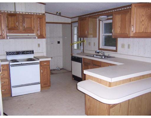 769 East Otis Road Otis, MA 01253 - Photo 2 of 3 a kitchen with a stove a sink and a refrigerator