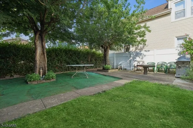 a view of backyard with sitting area
