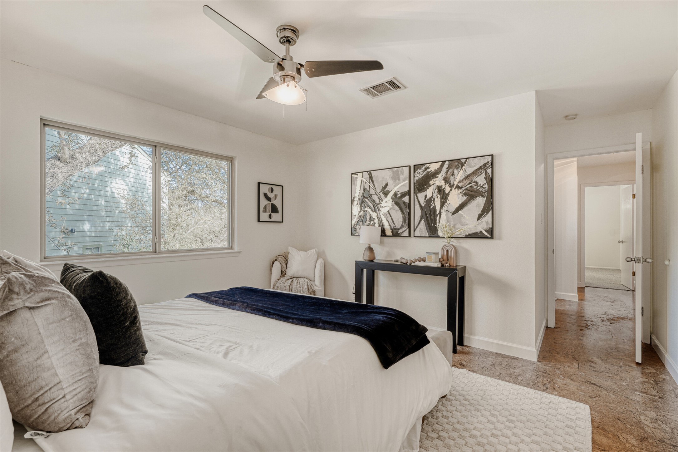 6701 Stage Coach Trail Austin, TX 78745 - Photo 12 of 23 Bedroom featuring baseboards and a ceiling fan