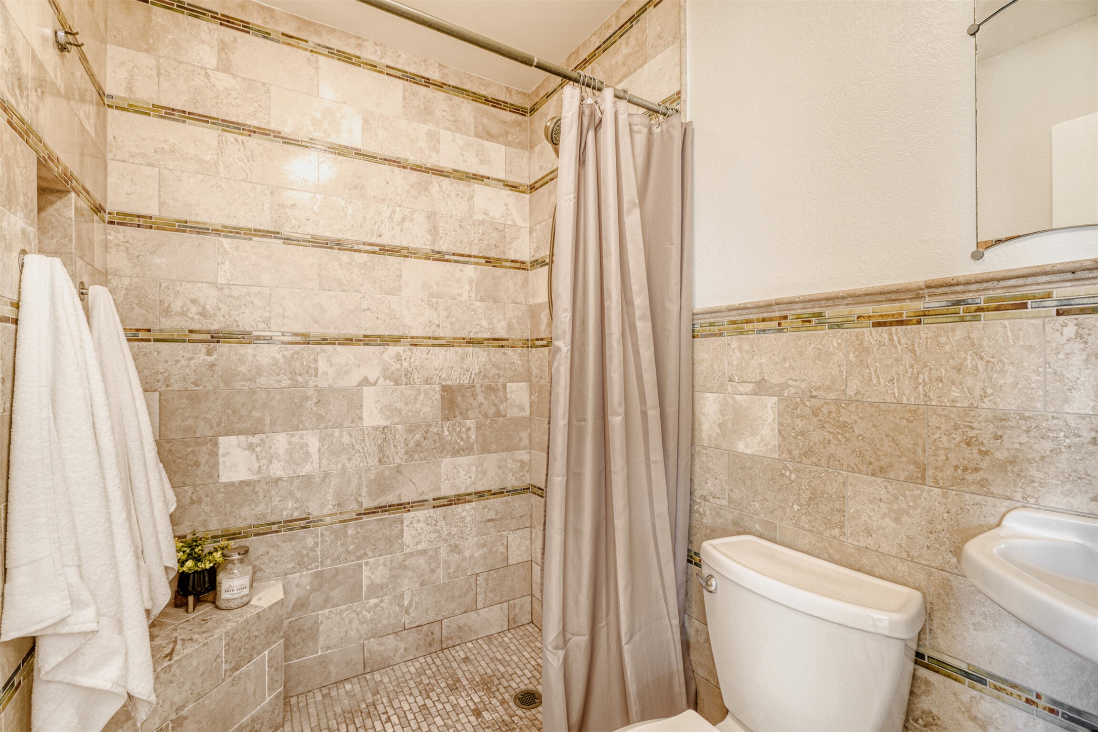 6701 Stage Coach Trail Austin, TX 78745 - Photo 16 of 23 Bathroom with tiled shower and tile walls