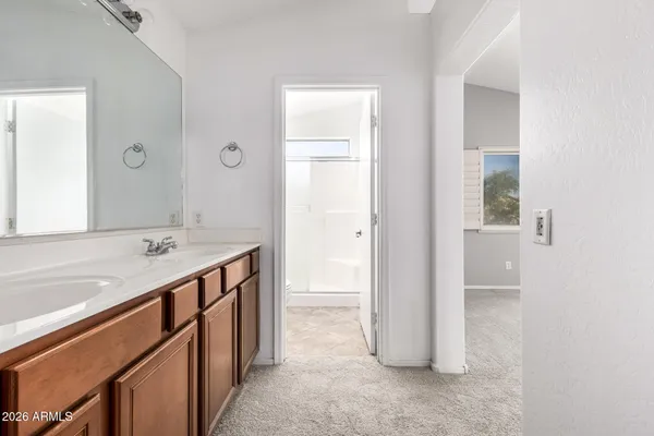 a bathroom with a shower a toilet and a sink