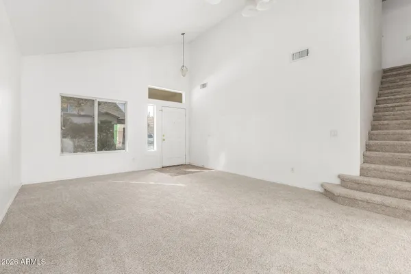 a view of an empty room with a window