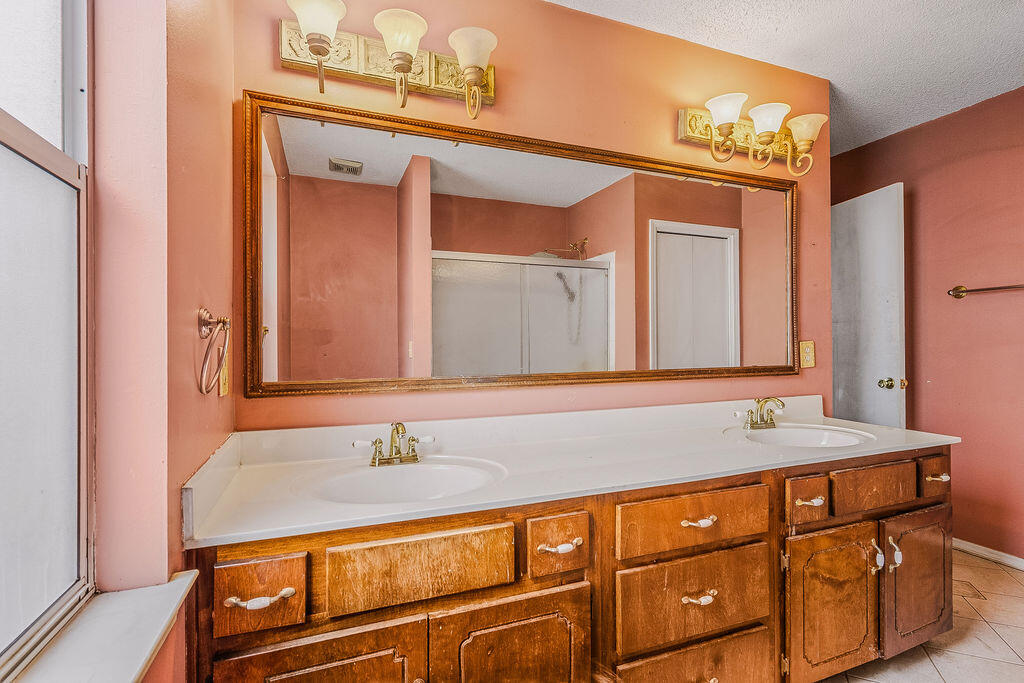 53 4th Street Shalimar, FL 32579 - Photo 29 of 47 a bathroom with a sink and a mirror