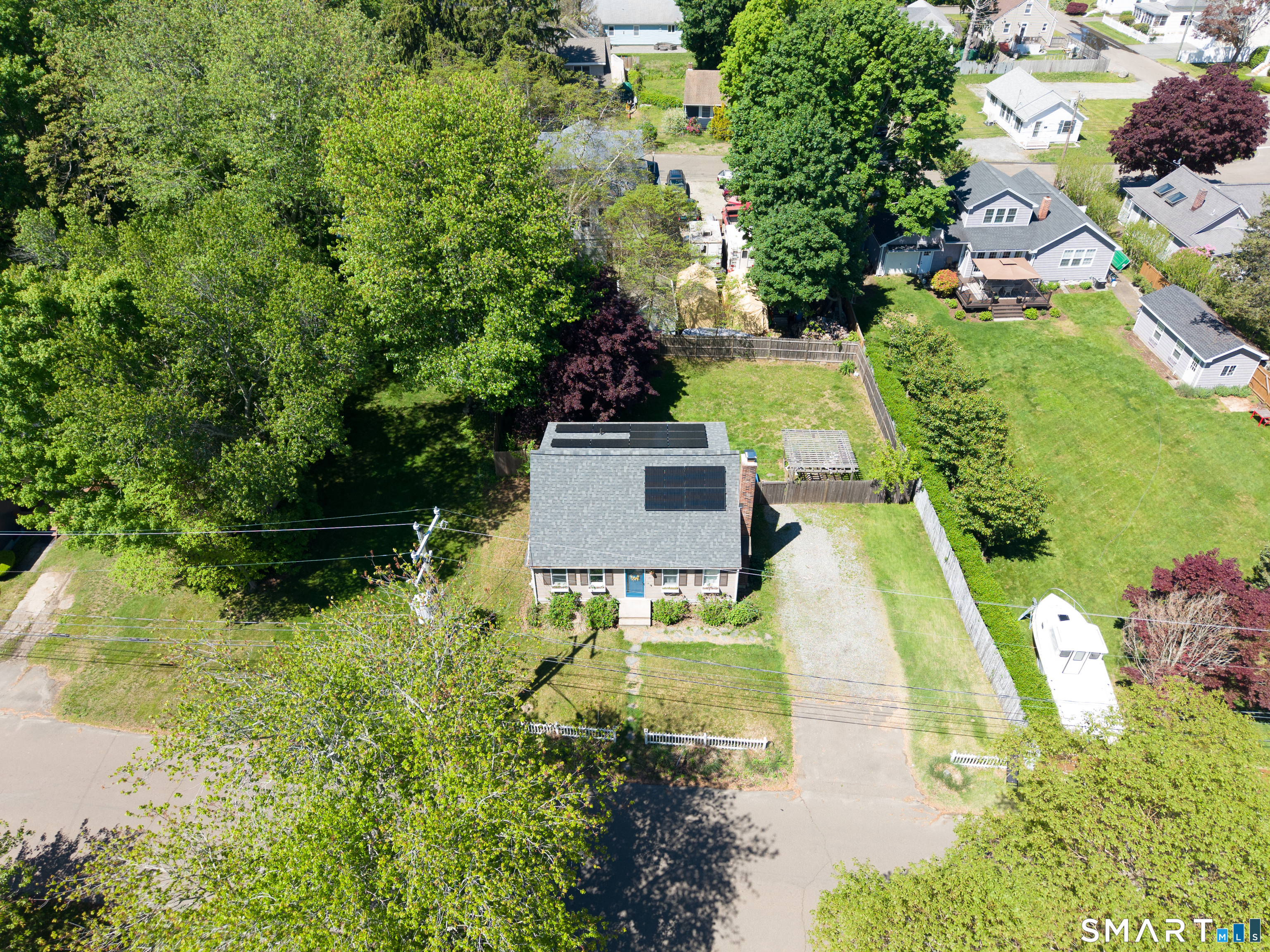 15 Bluff Avenue Clinton, CT 06413 - Photo 31 of 38 an aerial view of a house with a yard swimming pool and outdoor seating