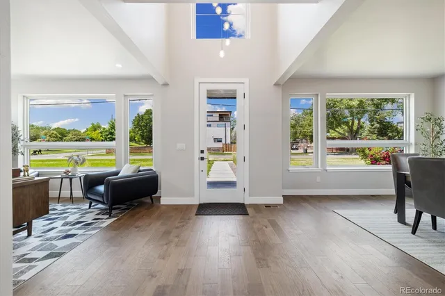 a view of a dining room with furniture window and wooden floor