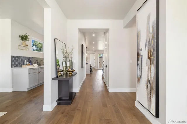a living room with furniture a rug and a fireplace