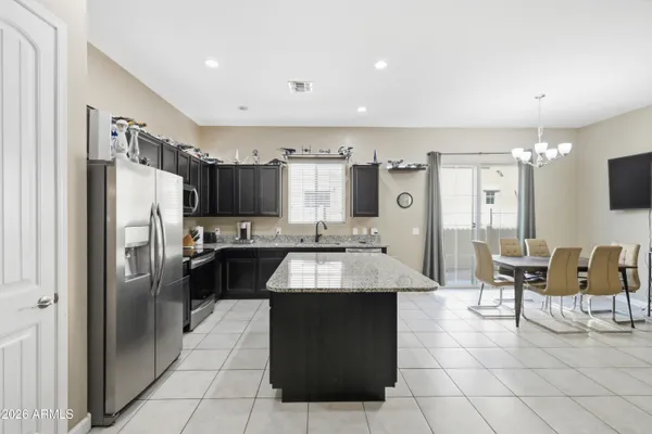 a kitchen with stainless steel appliances a stove sink and microwave