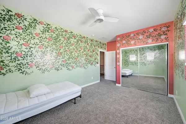 a room with a large window and chandelier