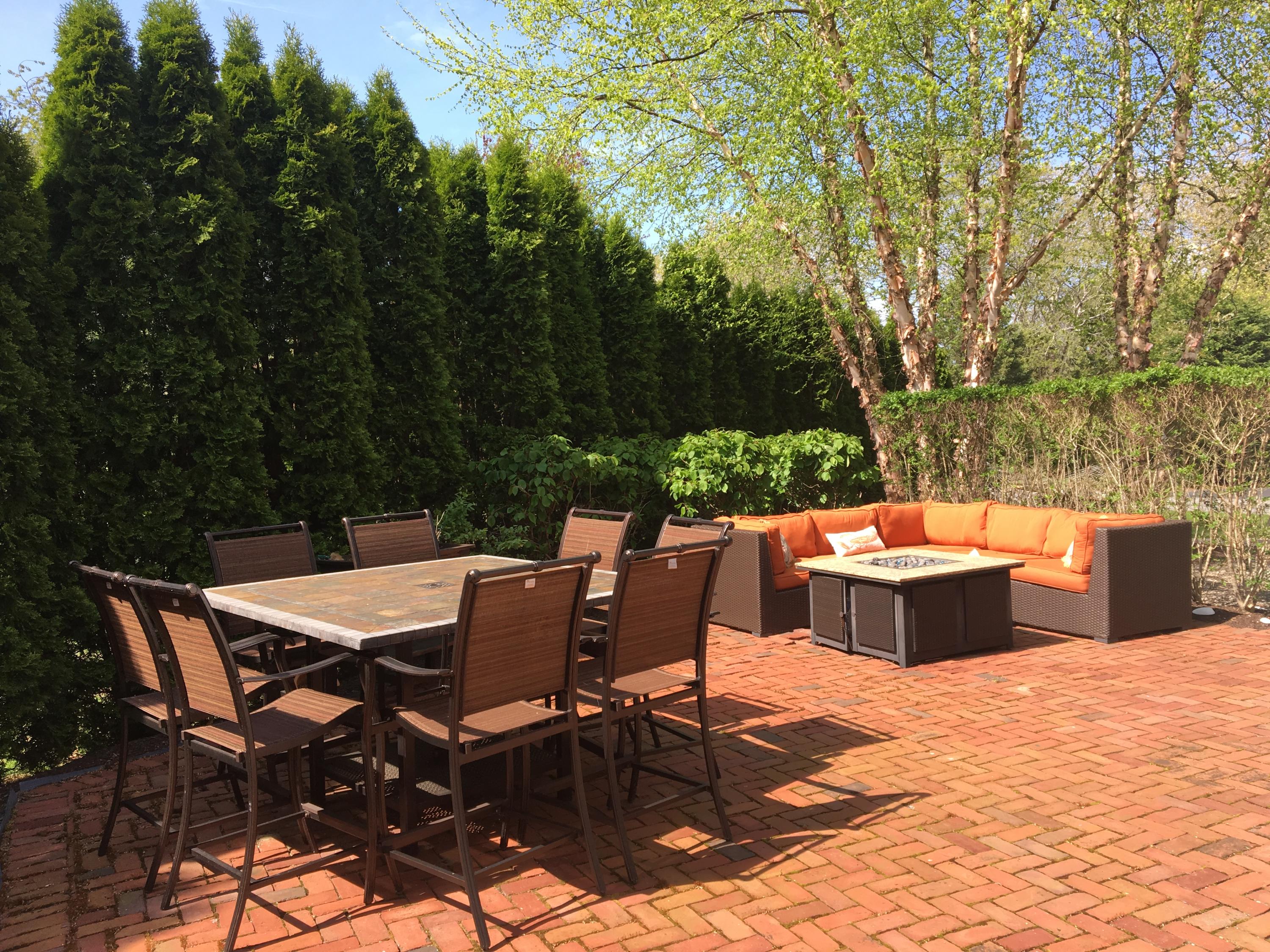 23 Torrey Road East Sandwich, MA 02537 - Photo 18 of 25 a view of a patio with a dining table and chairs with a small yard