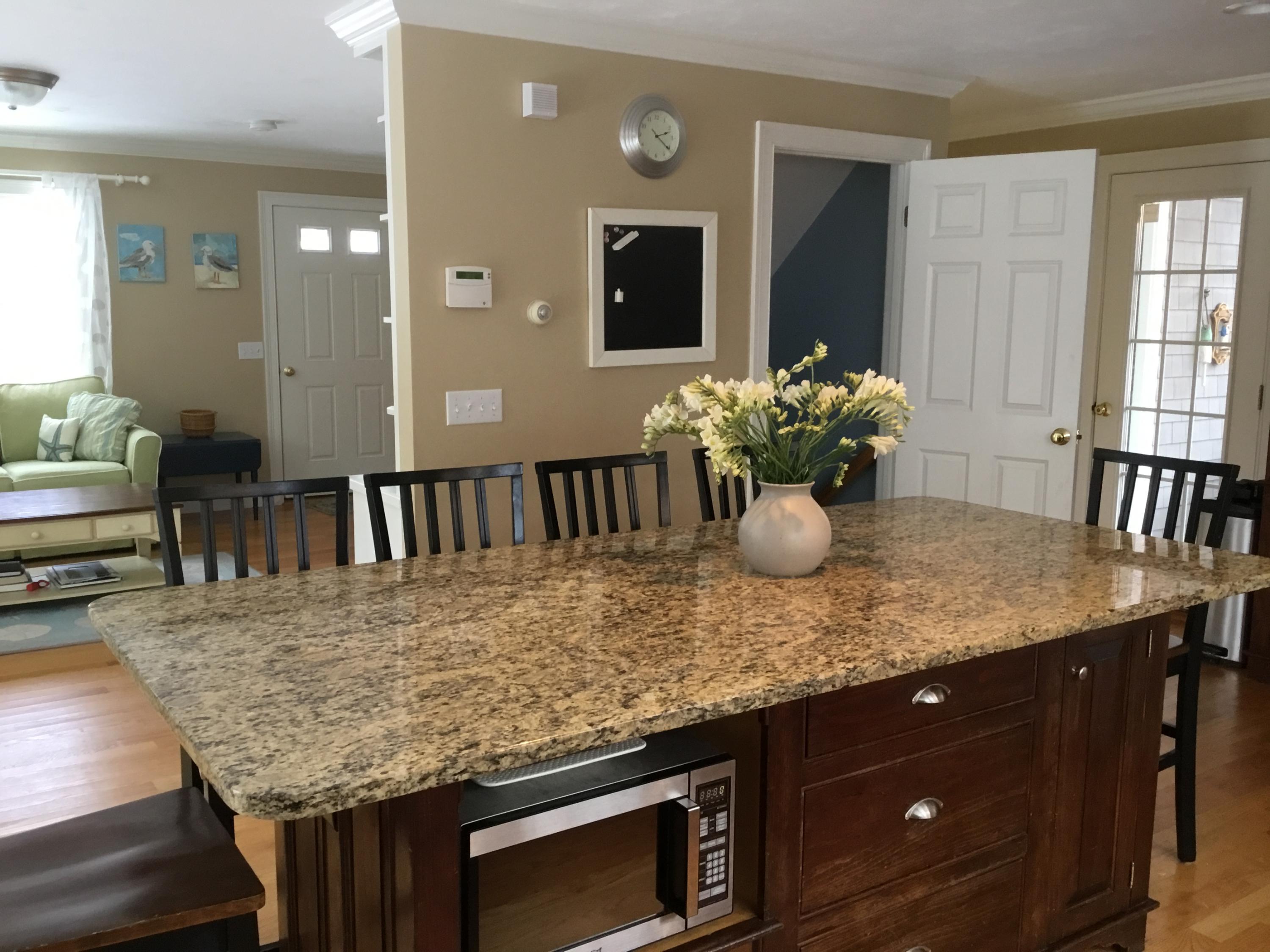 23 Torrey Road East Sandwich, MA 02537 - Photo 10 of 25 a view of kitchen island with granite countertop furniture