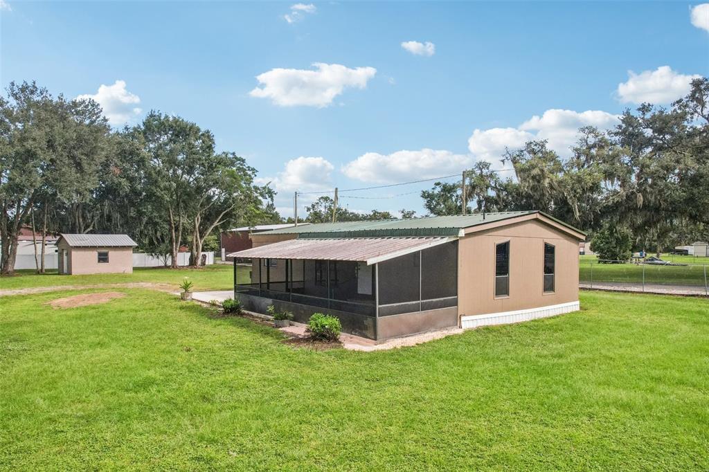 4708 Gallagher Road Plant City, FL 33565 - Photo 15 of 62 a front view of a house with garden