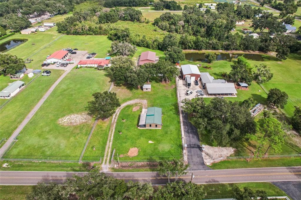 4708 Gallagher Road Plant City, FL 33565 - Photo 18 of 62 an aerial view of residential houses with outdoor space and street view