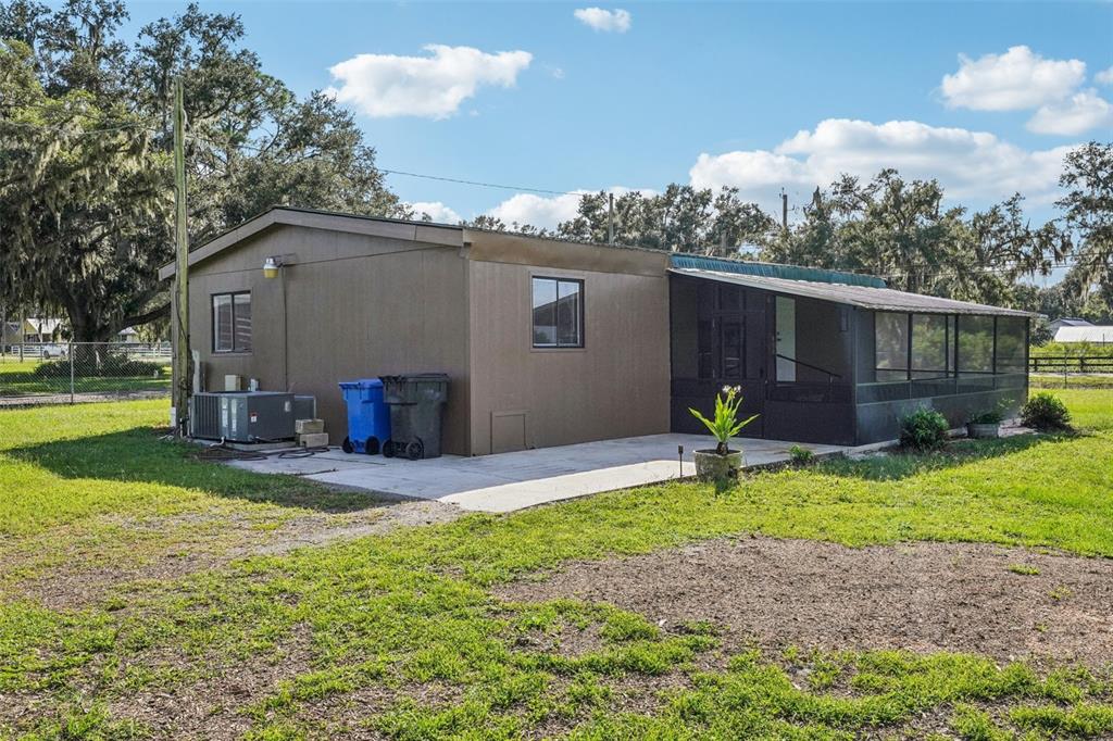 4708 Gallagher Road Plant City, FL 33565 - Photo 22 of 62 a view of a house with backyard and a tree