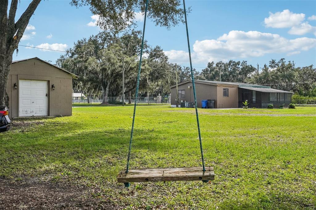 4708 Gallagher Road Plant City, FL 33565 - Photo 24 of 62 a view of a house with a yard