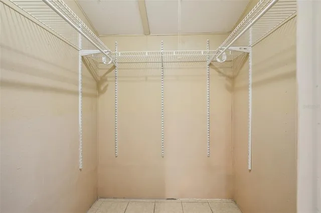 a view of a livingroom with a ceiling fan and window