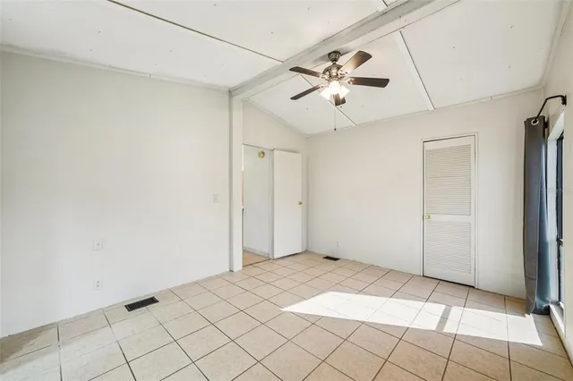 a view of an empty room and window