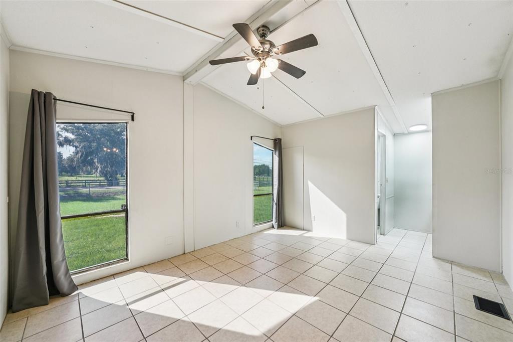 4708 Gallagher Road Plant City, FL 33565 - Photo 35 of 62 a view of a livingroom with a ceiling fan and window