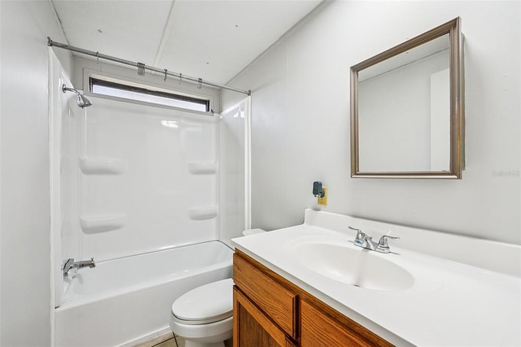 4708 Gallagher Road Plant City, FL 33565 - Photo 37 of 62 a bathroom with a sink toilet and shower