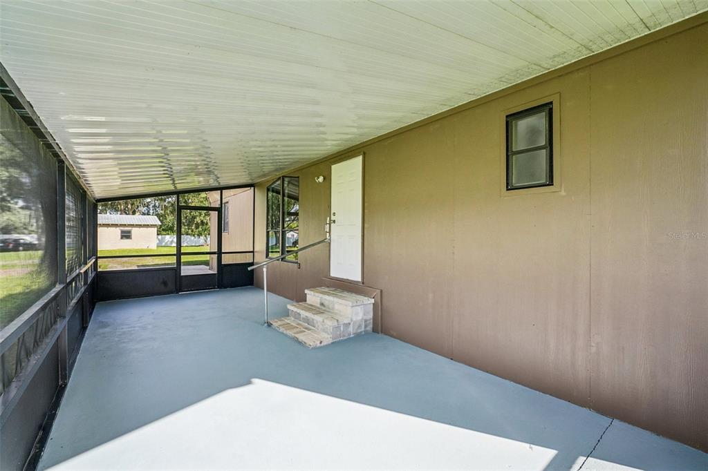 4708 Gallagher Road Plant City, FL 33565 - Photo 4 of 62 a view of empty room with wooden floor
