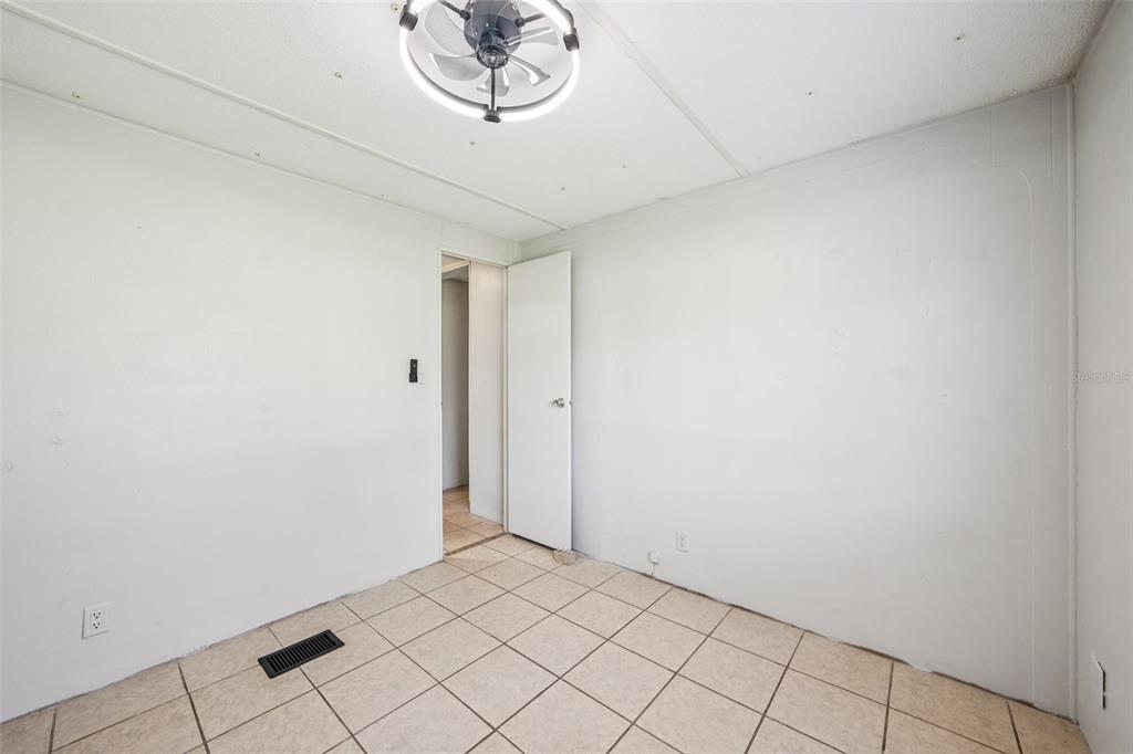 4708 Gallagher Road Plant City, FL 33565 - Photo 41 of 62 a view of a hallway with a chandelier fan