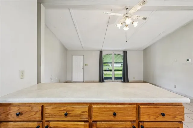 a view of kitchen with furniture and cabinets