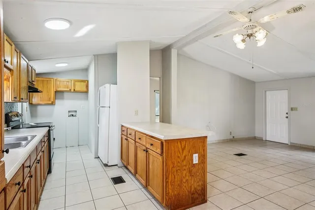 a view of a backyard with plants and a garden