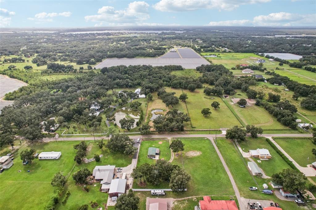 4708 Gallagher Road Plant City, FL 33565 - Photo 6 of 62 an aerial view of residential houses with outdoor space and swimming pool