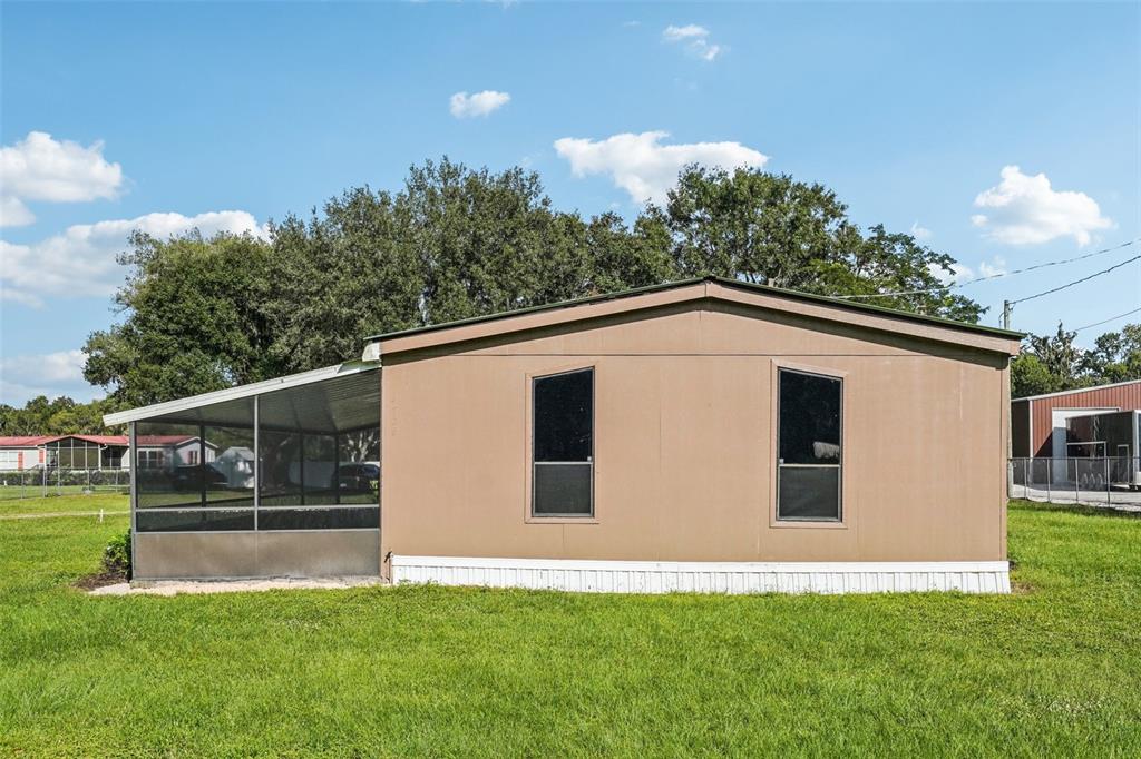 4708 Gallagher Road Plant City, FL 33565 - Photo 62 of 62 a house view with a garden space