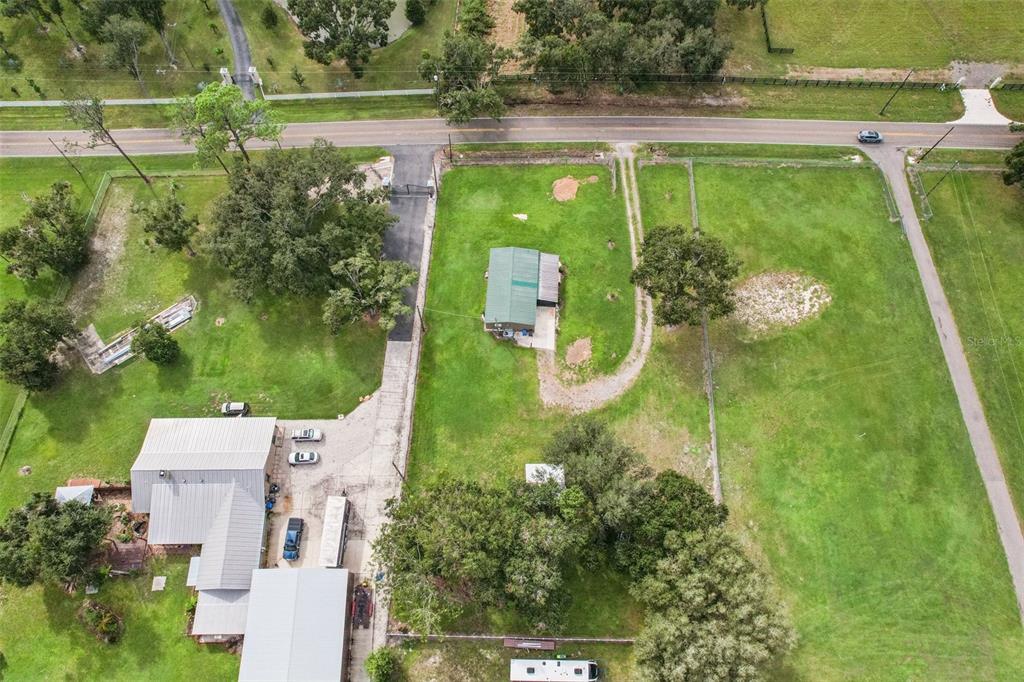 4708 Gallagher Road Plant City, FL 33565 - Photo 7 of 62 an aerial view of a residential houses with outdoor space and street view