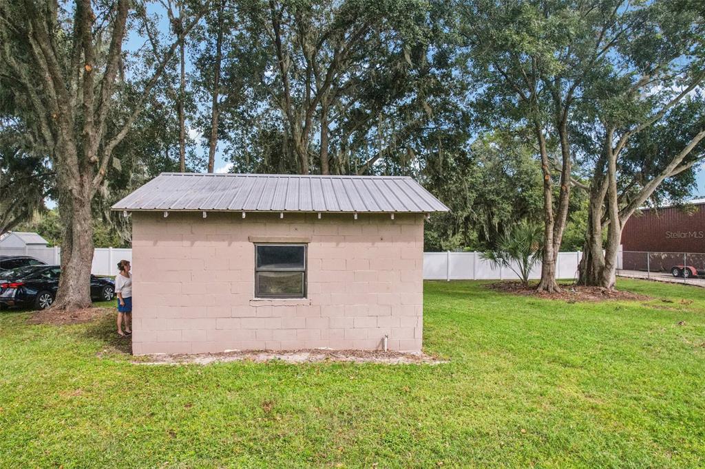4708 Gallagher Road Plant City, FL 33565 - Photo 9 of 62 a front view of a house with a yard and garage