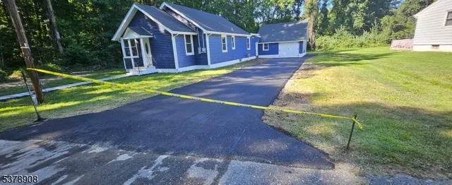 a view of a yard in front of a house with a yard