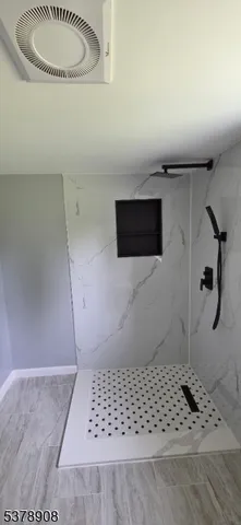 a view of hallway with wooden floor