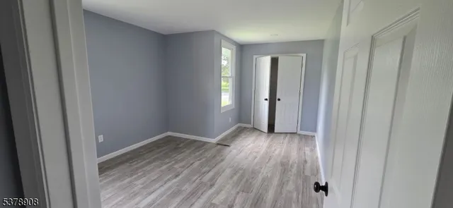 a view of gallery with wooden floor