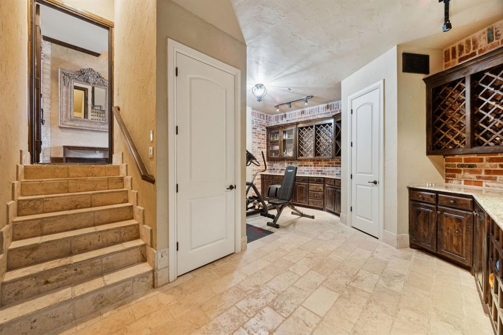 1411 Long And Winding Road Mansfield, TX 76063 - Photo 18 of 37 wine cellar/safe room is downstairs from first floor