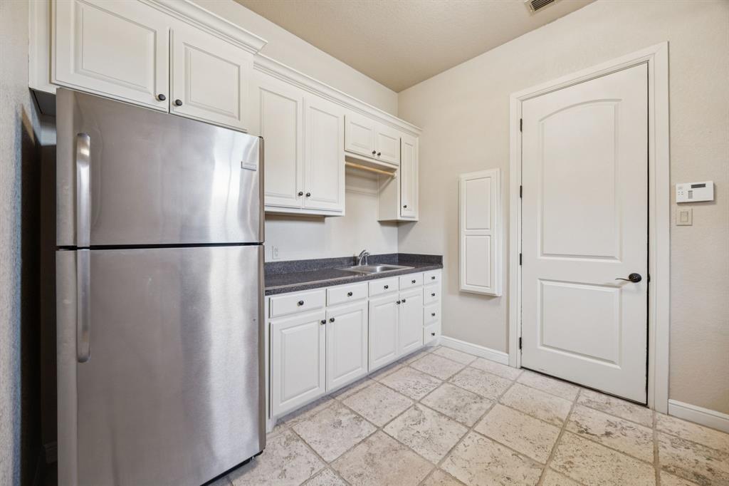 1411 Long And Winding Road Mansfield, TX 76063 - Photo 33 of 37 laundry room with door to garage