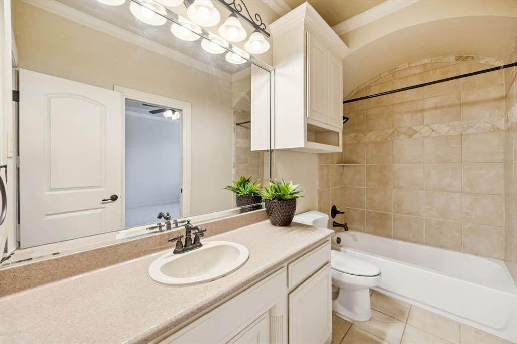 1411 Long And Winding Road Mansfield, TX 76063 - Photo 8 of 37 upstairs bathroom open to bedroom and hallway