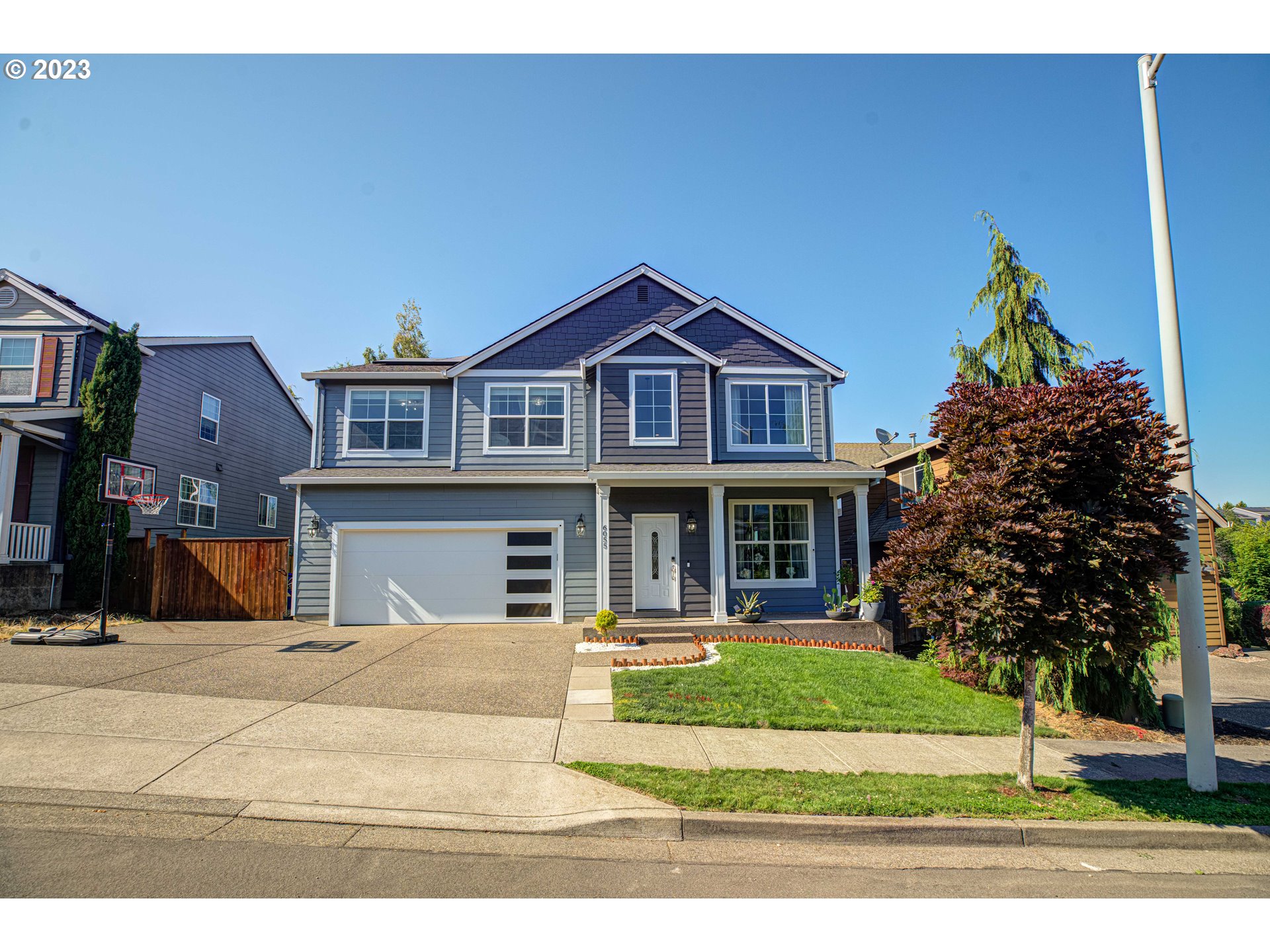 6055 Southeast 28th Street Gresham, OR 97080 - Photo 2 of 48 a view of a house with a yard